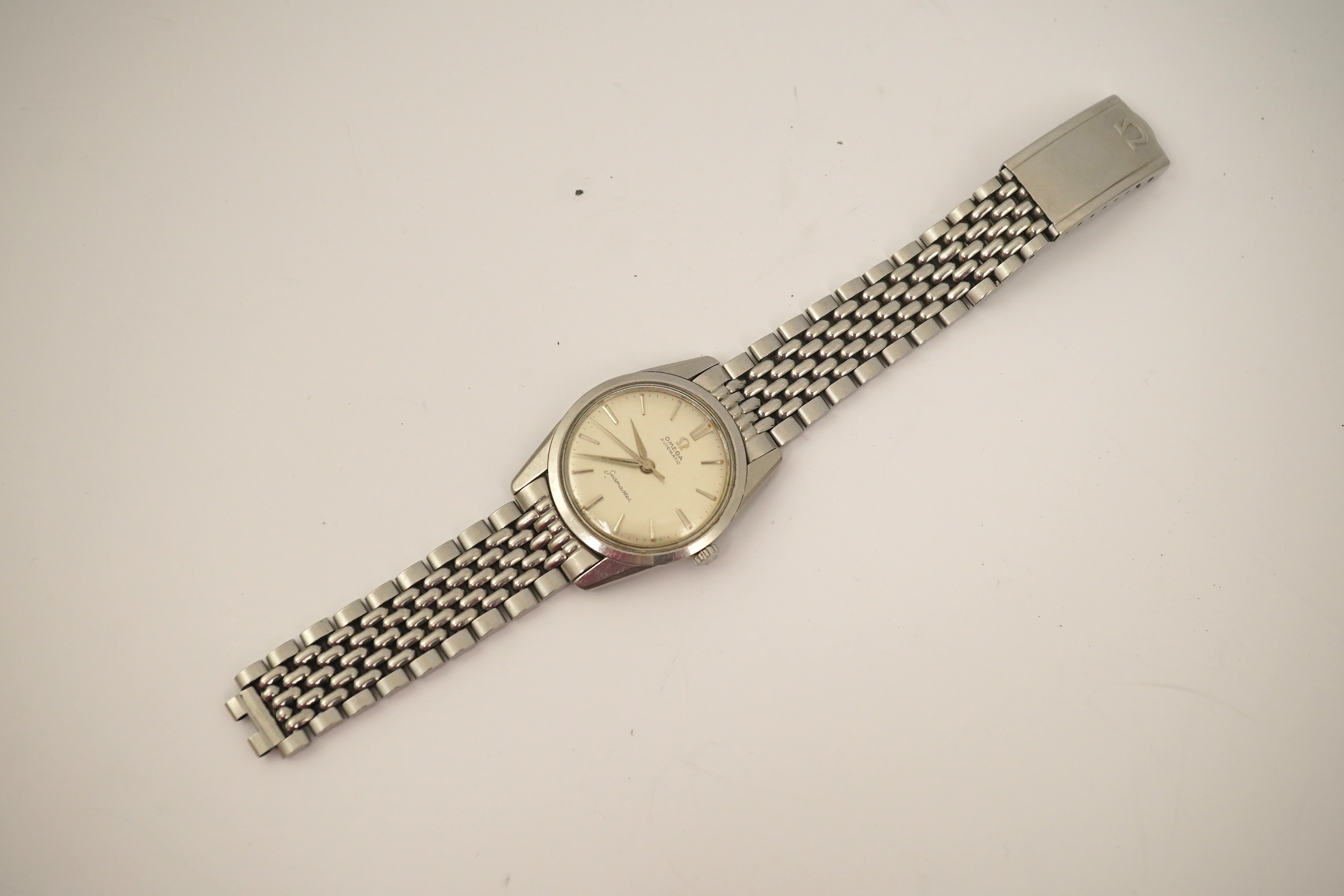 A gentleman's 1960's? stainless steel Omega Seamaster automatic wrist watch, on a stainless steel Omega bracelet